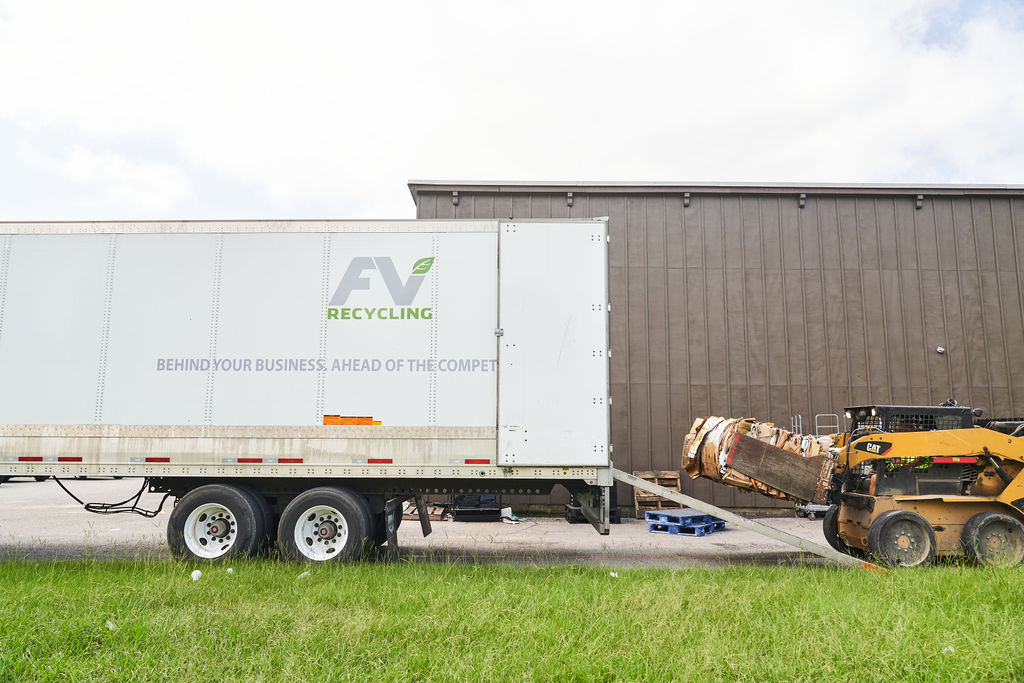 loading fv recycling semi truck with commercial waste