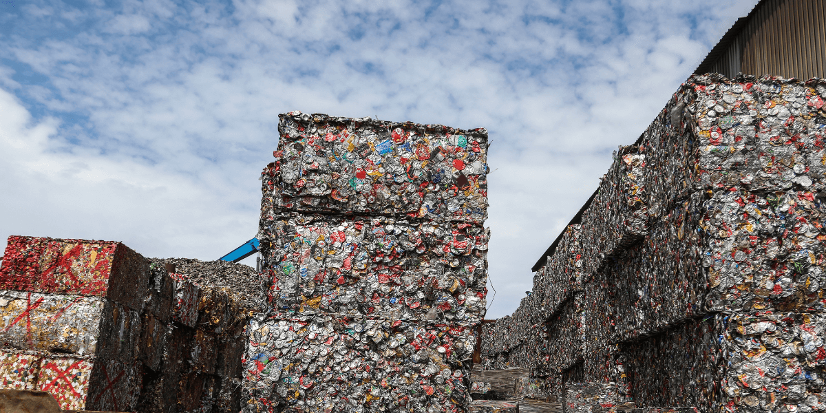 compacted aluminum waste bales stacked outside