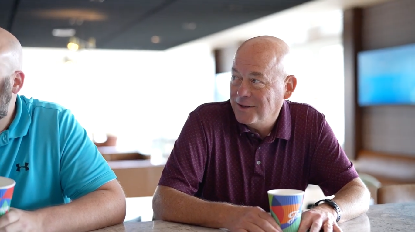 FV Recycling team member Tommy Griffin speaking with colleague about recycling equipment operations and field support