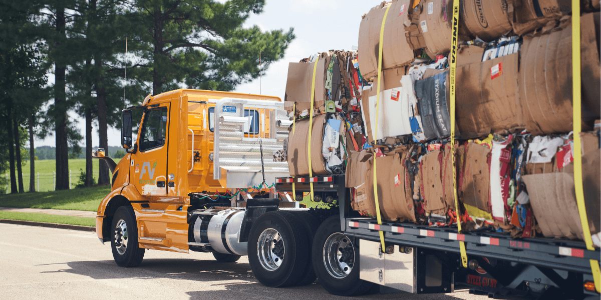 A FV Recycling Hauling truck picking up OCC cardboard bales. 