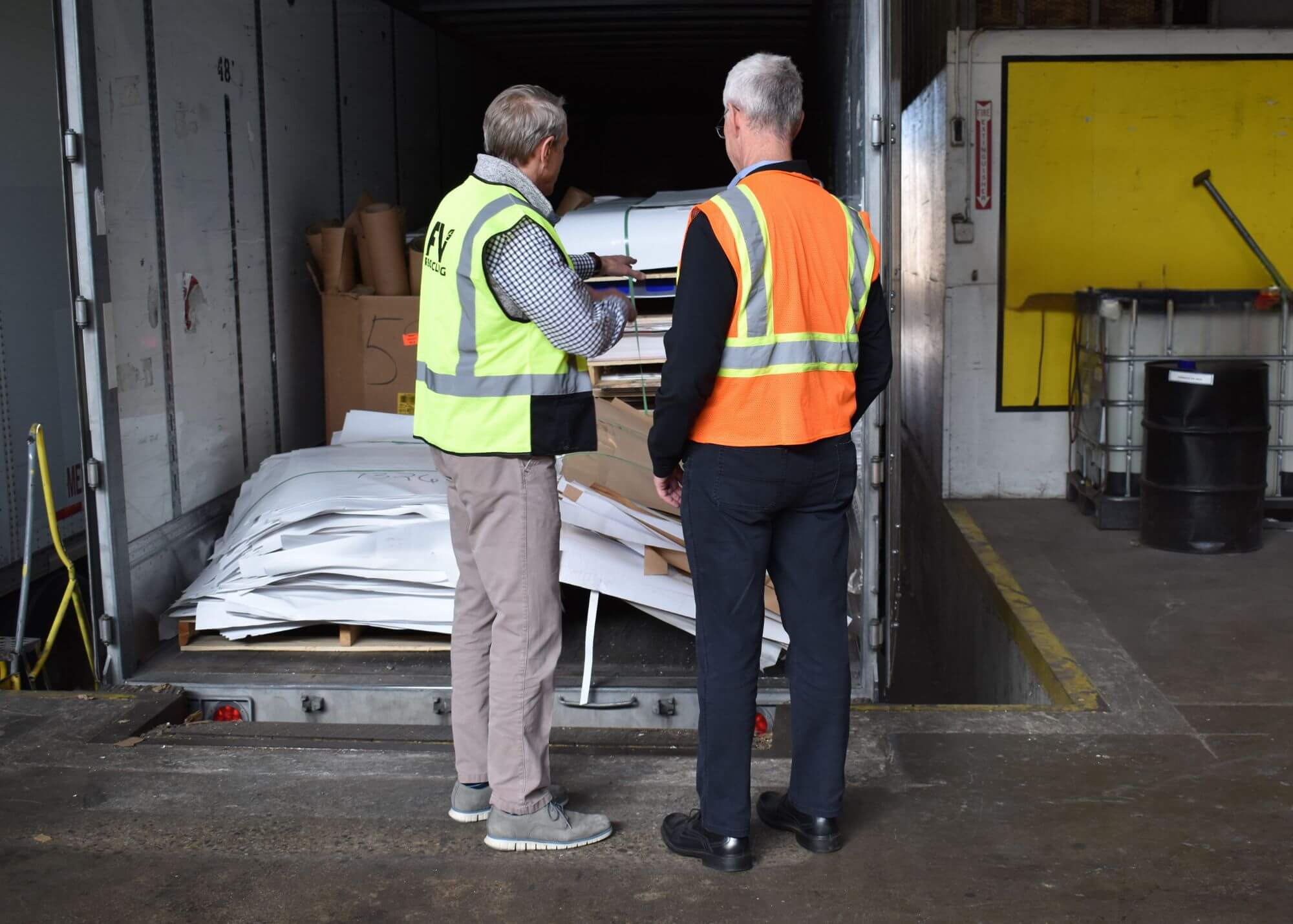On the left is Gene Smith, President of FV Recycling and right is Don Gaines, Mid America Paper Recycling walking around the Mid America Paper Recycling warehouse