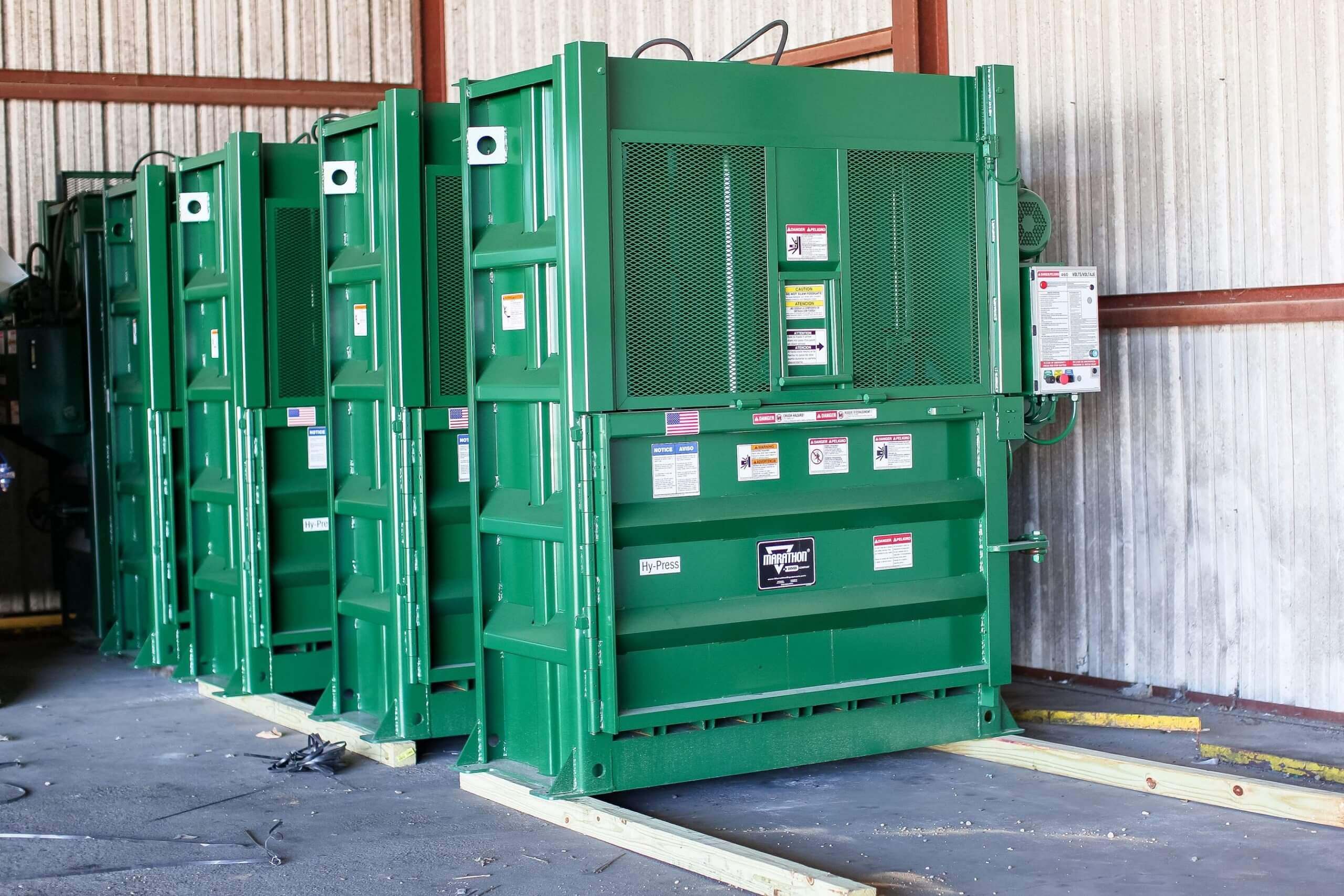 FV Recycling green baler in warehouse