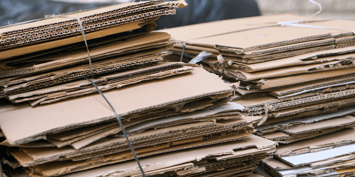 Stacks of cardboard held together by Bale Wire. 