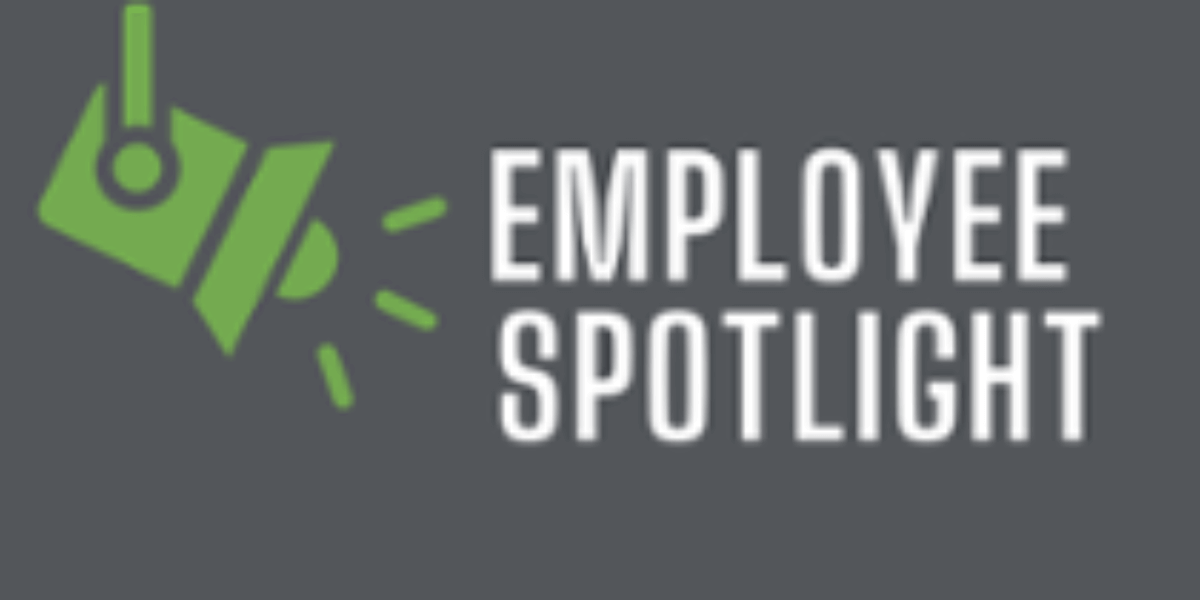 Employee spotlight graphic with a green spotlight. 